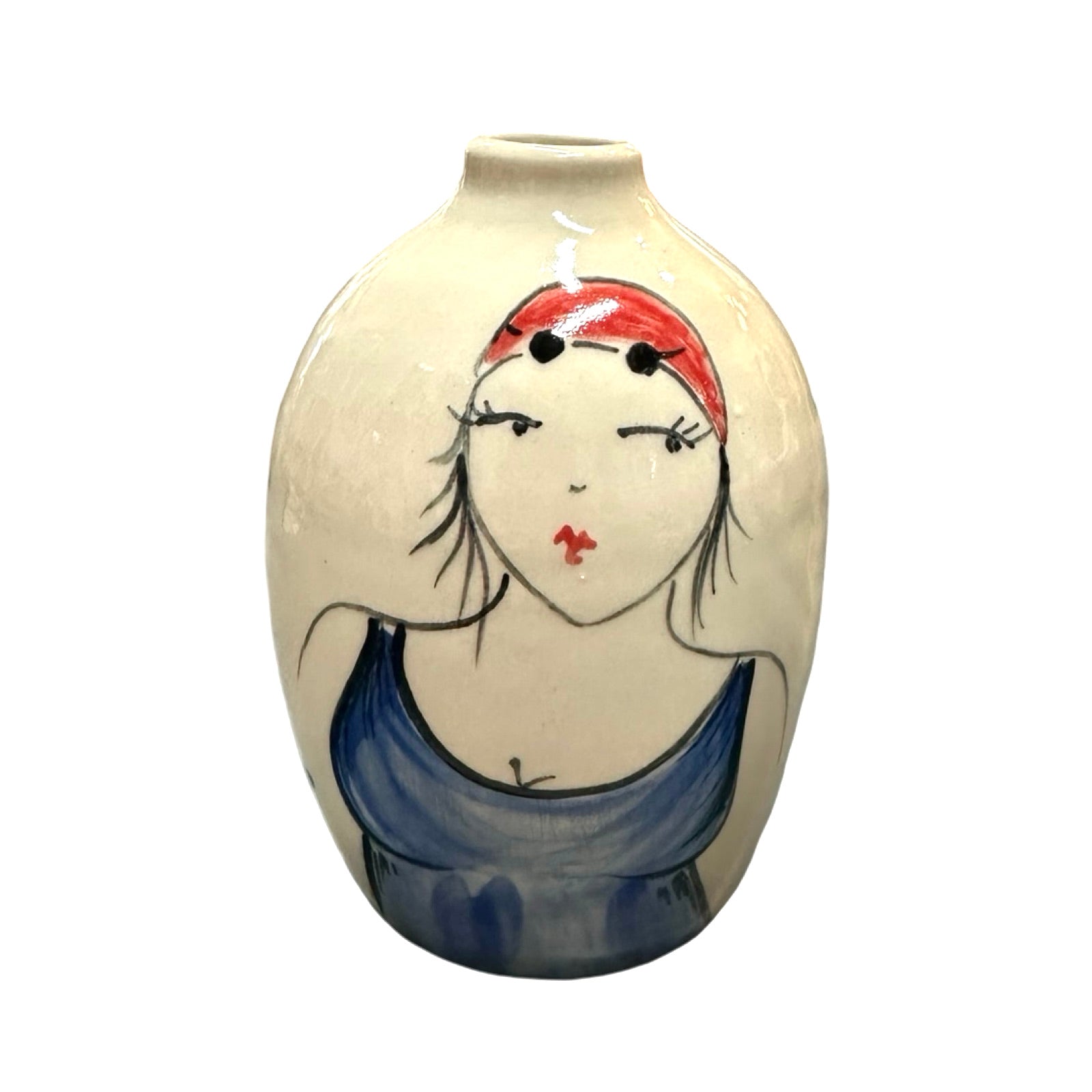 A cream coloured ceramic bud vase with a female wild swimmer wearings a blue swimsuit and a red swim cap.