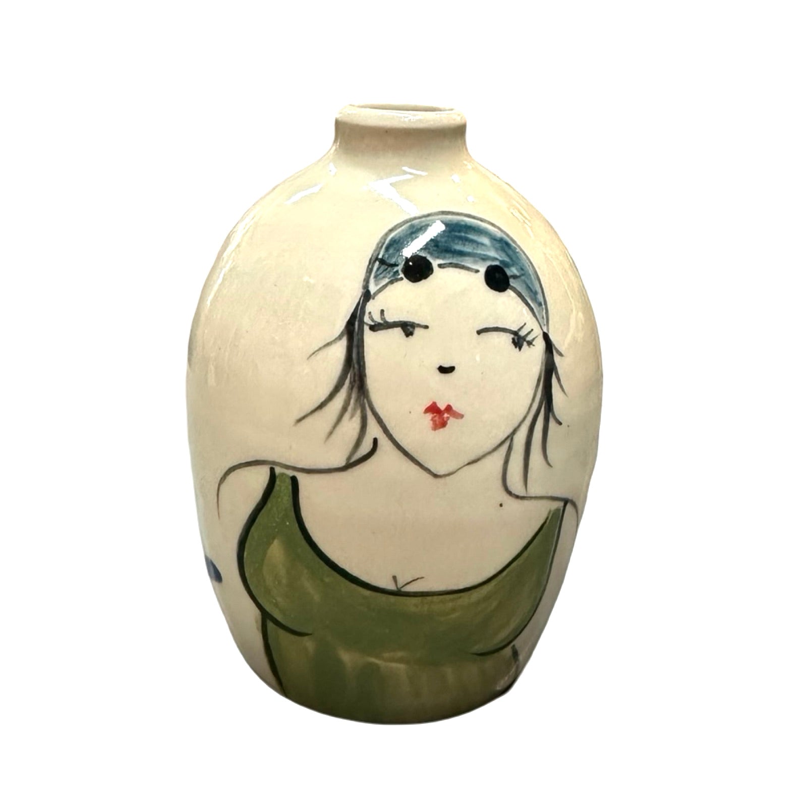 A cream coloured ceramic bud vase with a female wild swimmer wearings a green swimsuit and a blue swim cap.