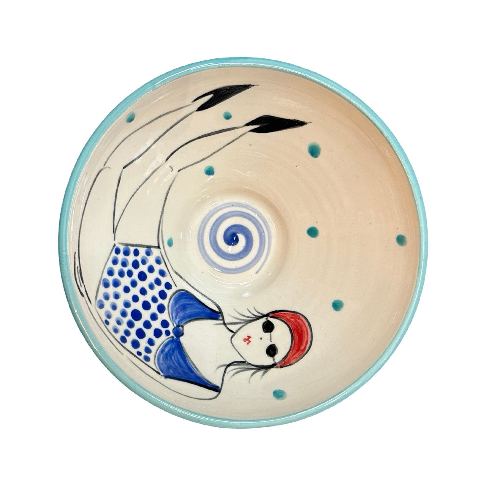 A cream ceramic cereal bowl with a female wild swimmer wearings a blue polka dot swimsuit and a red swim cap.