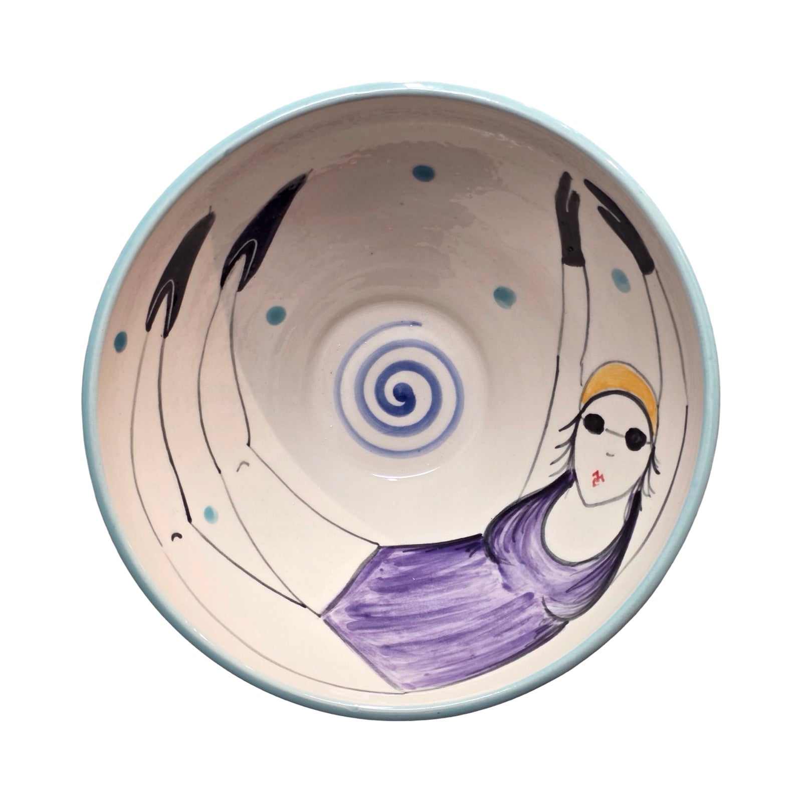 Ceramic bowl with artistic design of a woman swimming on a white background.