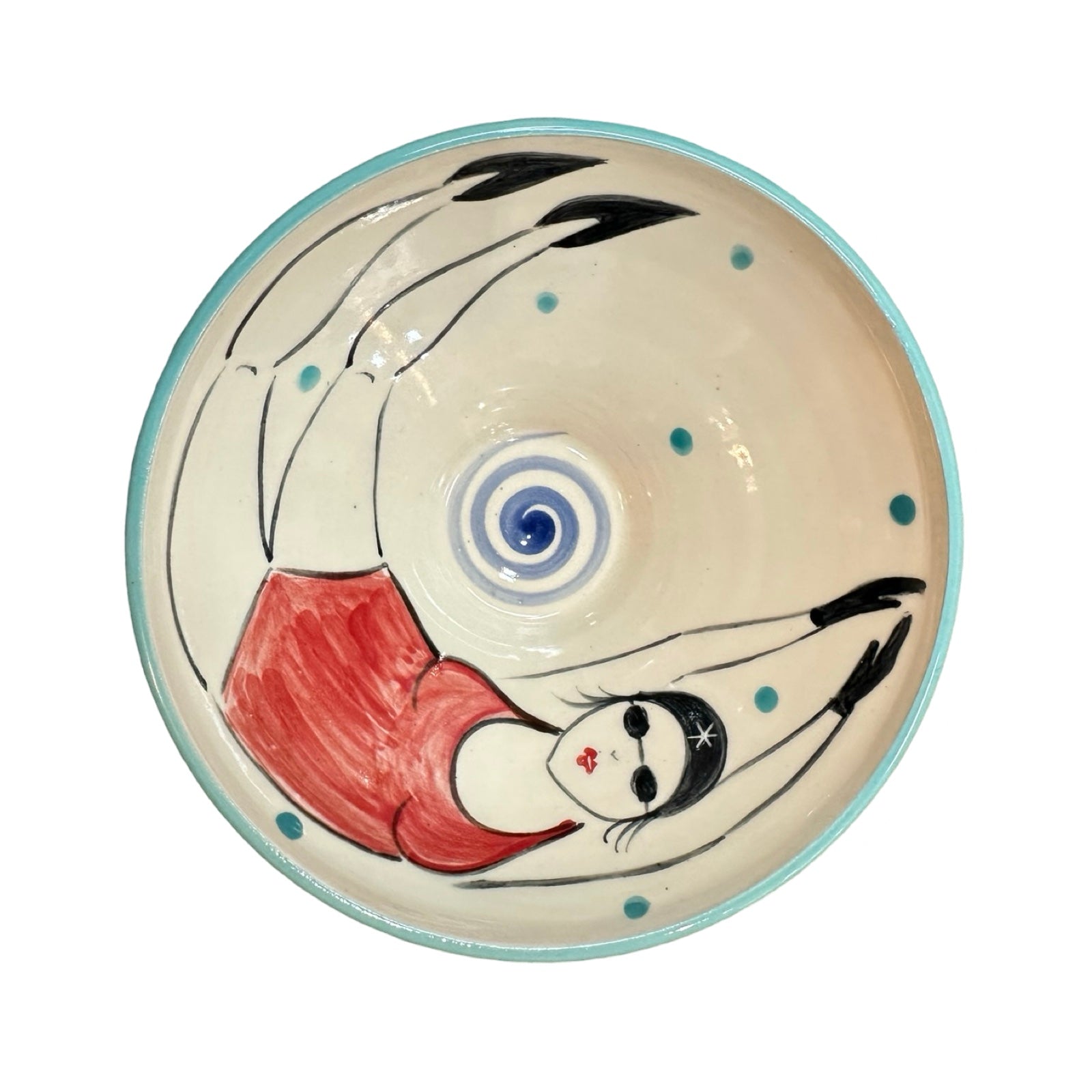 A cream ceramic cereal bowl with a female wild swimmer wearings a red swimsuit and a black swim cap.