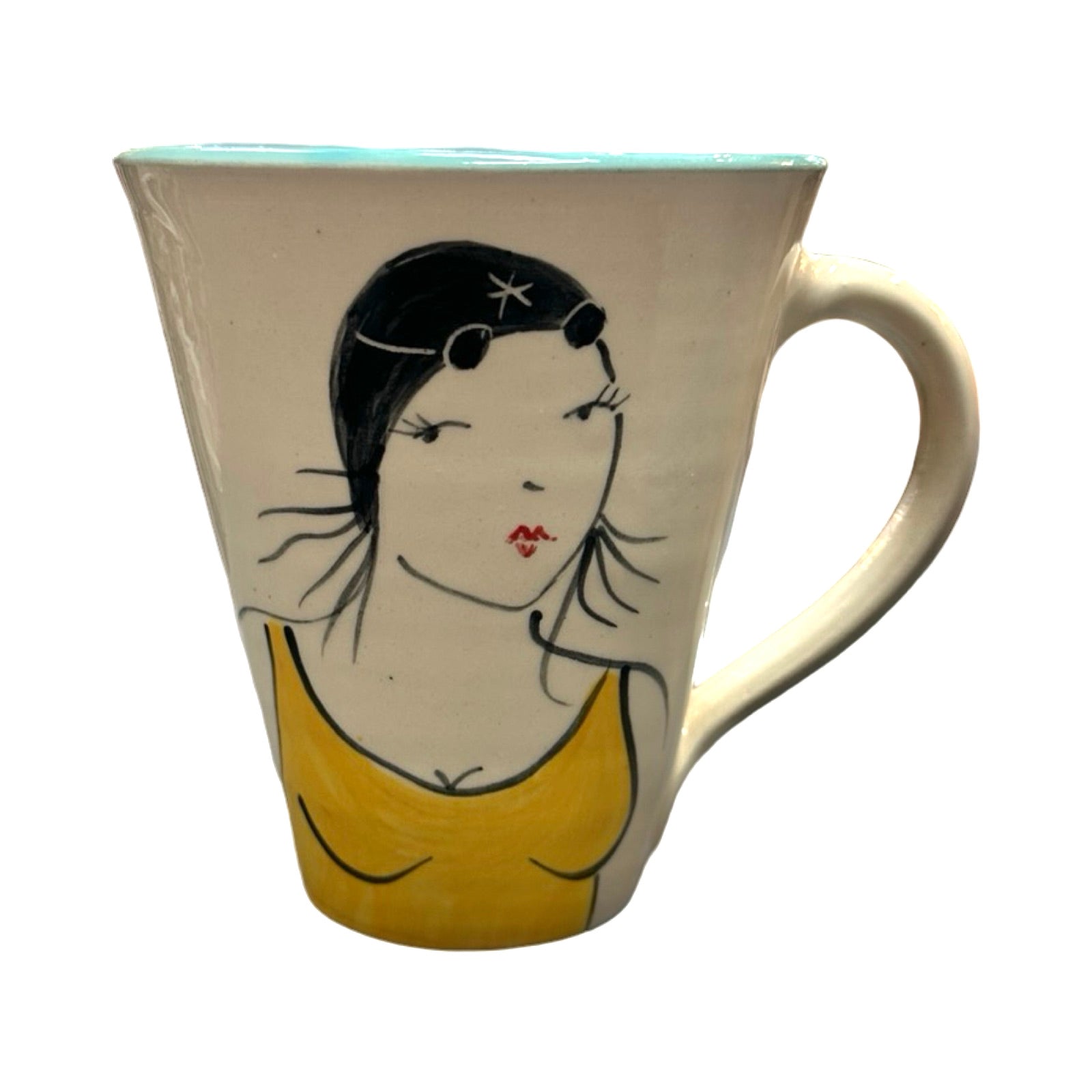 A cream coloured ceramic mug with a female wild swimmer wearing a yellow swimsuit and a black swim cap.