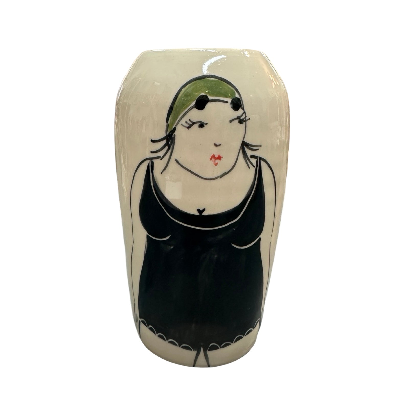 A cylindrical cream ceramic vase with a female wild swimmer on the front wearing a black swimsuit and a green swim cap.