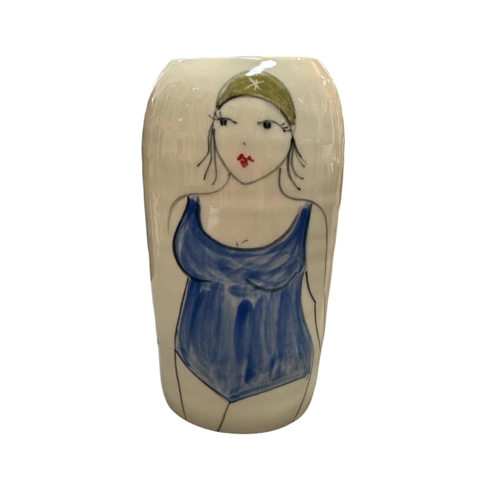 A cylindrical cream ceramic vase with a female wild swimmer on the front wearing a blue swimsuit and a green swim cap.