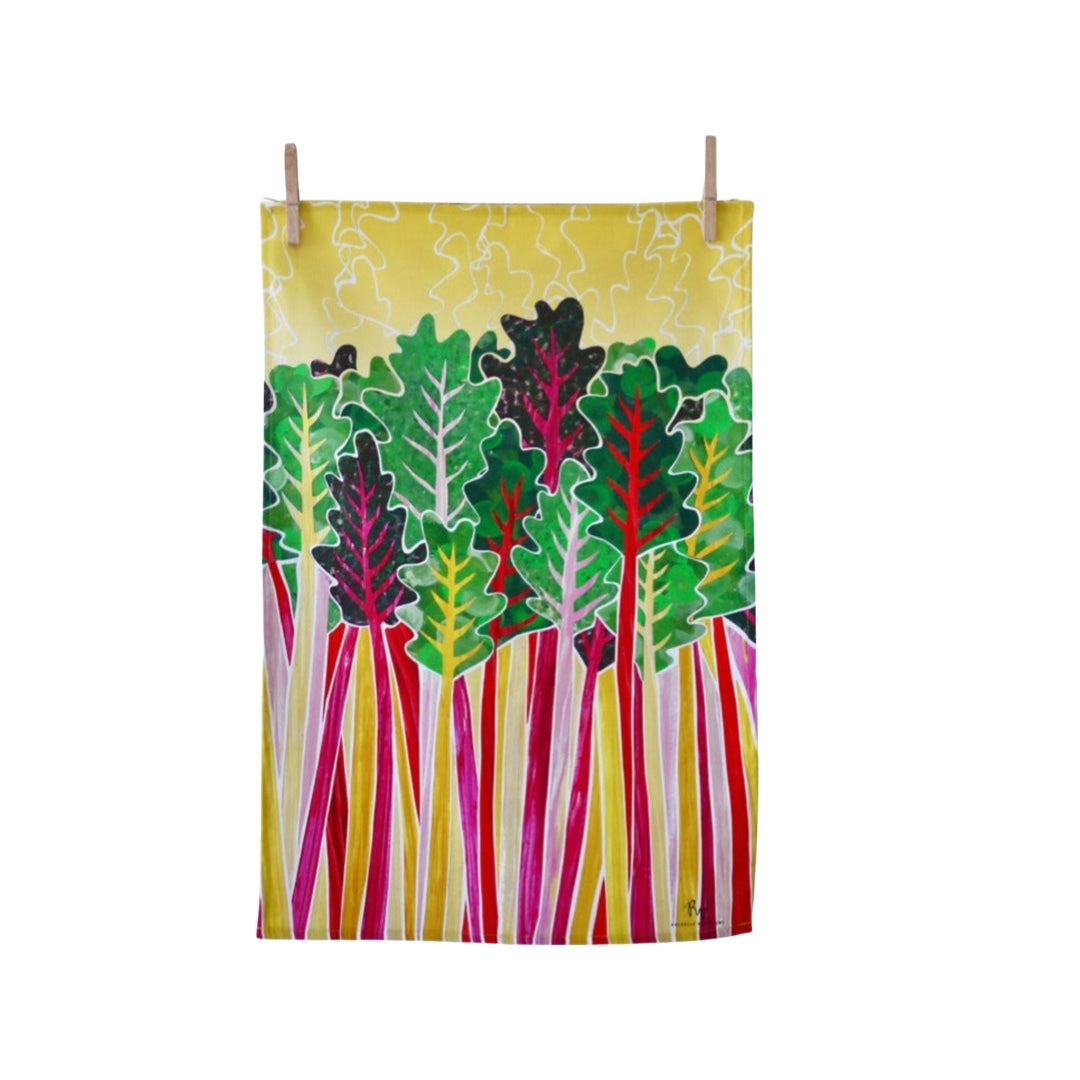 Tea towel featuring purple, pink and yellow Swiss chard with green leaves on a yellow background.