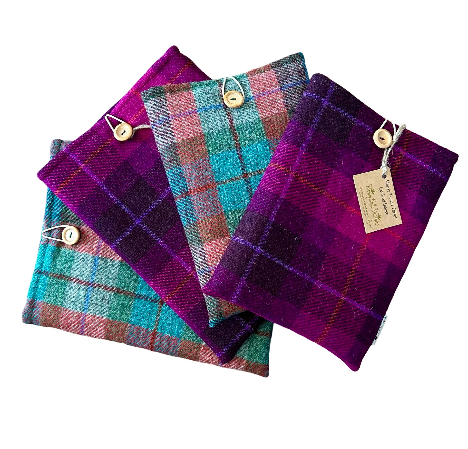 Four Harris tweed tablet sleeves in 2 colours and 2 sizes.