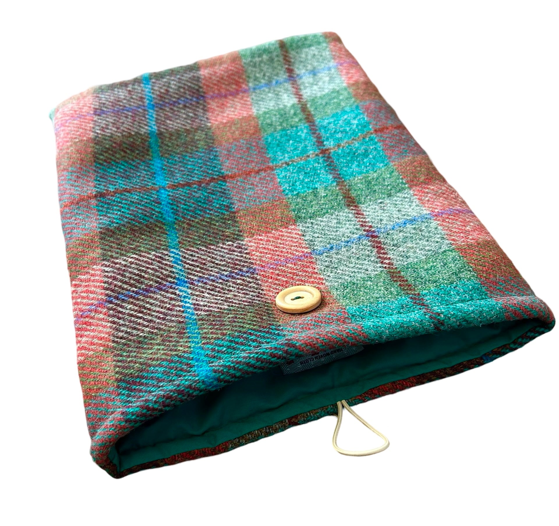 Showing the inner green cotton lining of the red/green check tweed tablet sleeve.