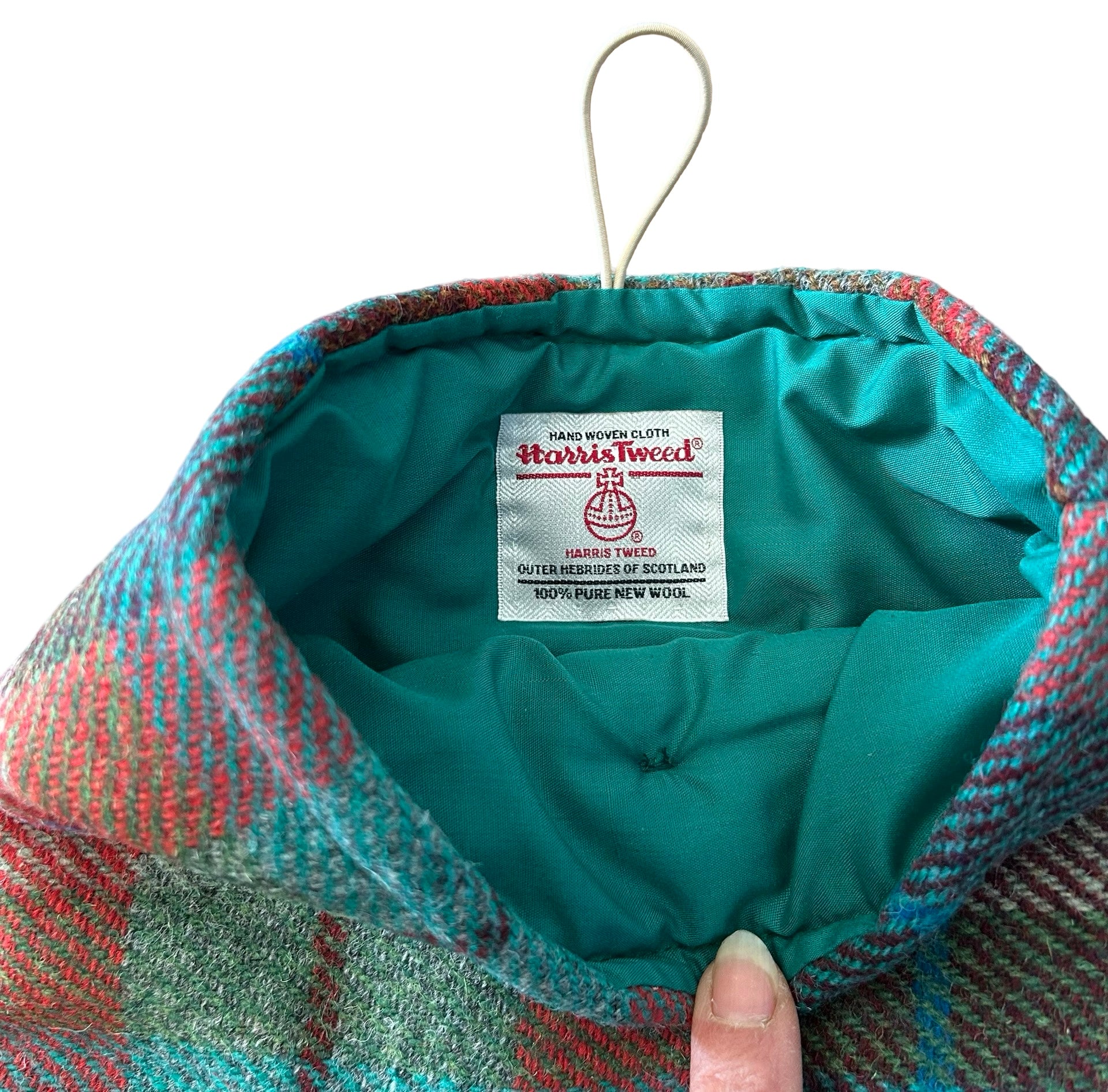 Showing the Harris tweed Orb label sewn into the inner lining of the harris tablet sleeve.