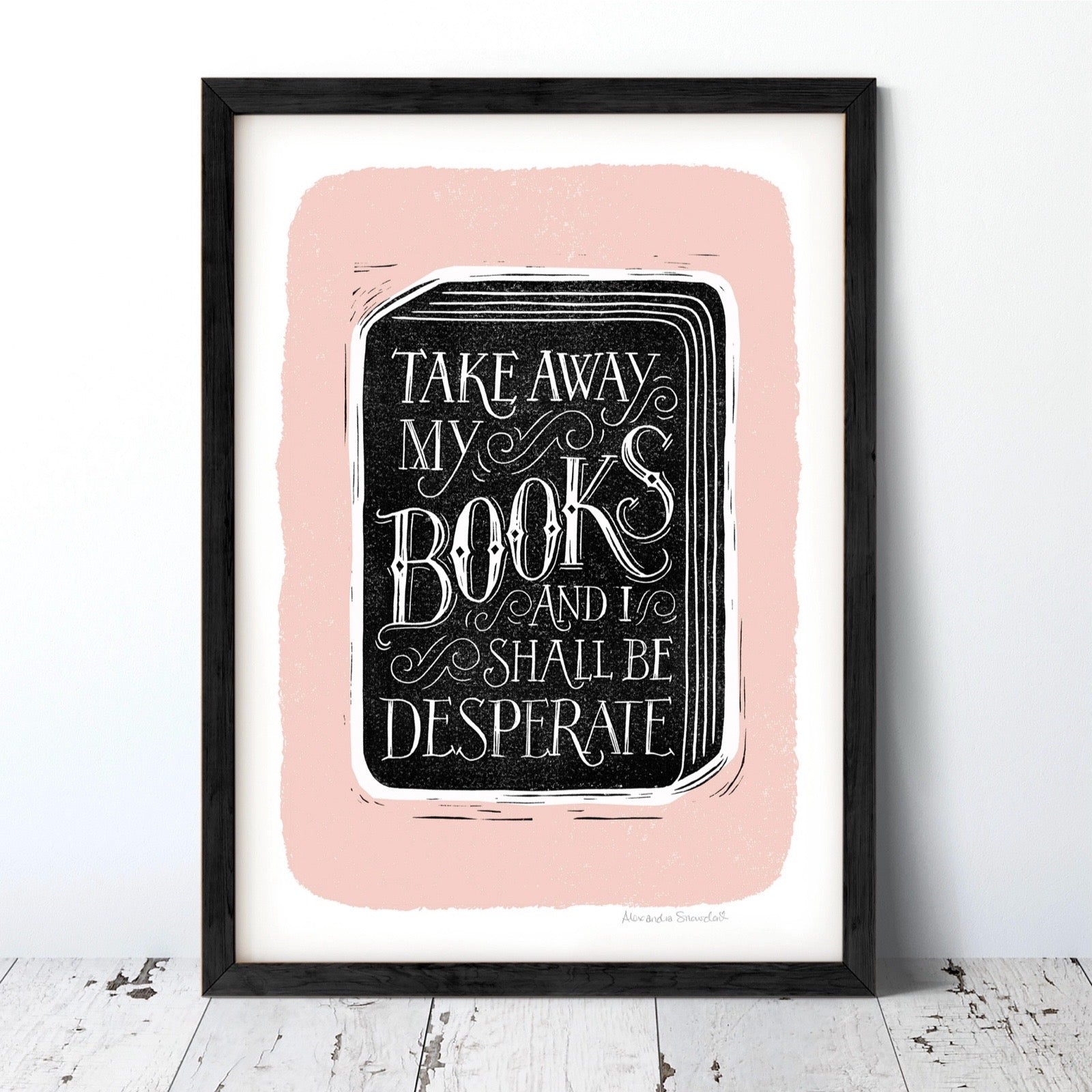 Framed print with text 'Take away my books and I shall be desperate' on a pink background.