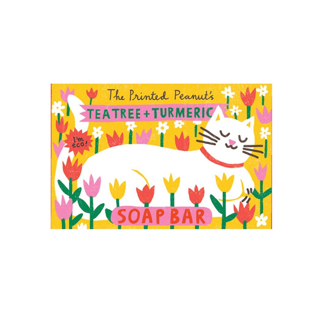 Soap bar packaging with a cat illustration and floral design on a white background.