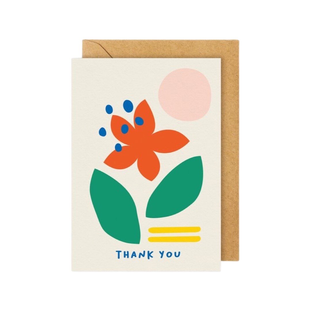 Thank you card with a red flower and green leaves, a pink sun and yellow line against a cream background.