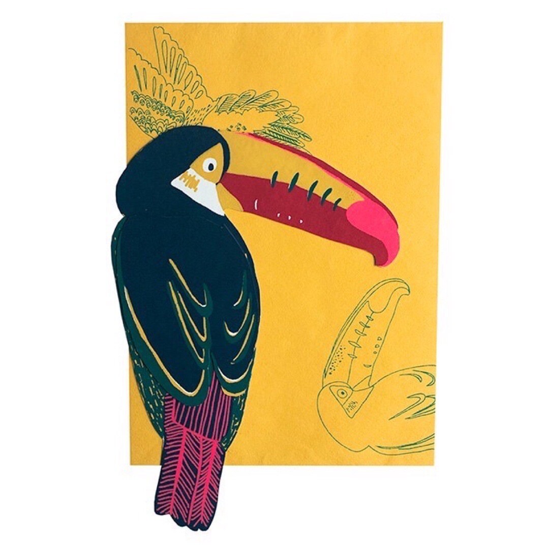 A toucan shaped pop up card with a yellow envelope.