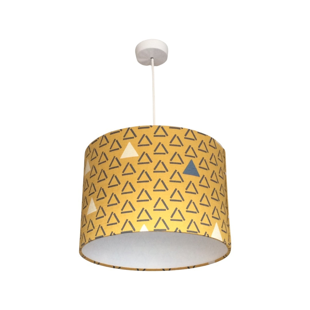 Drum lampshade covered in mustard barkcloth with grey open triangles and white closed and filled triangles
