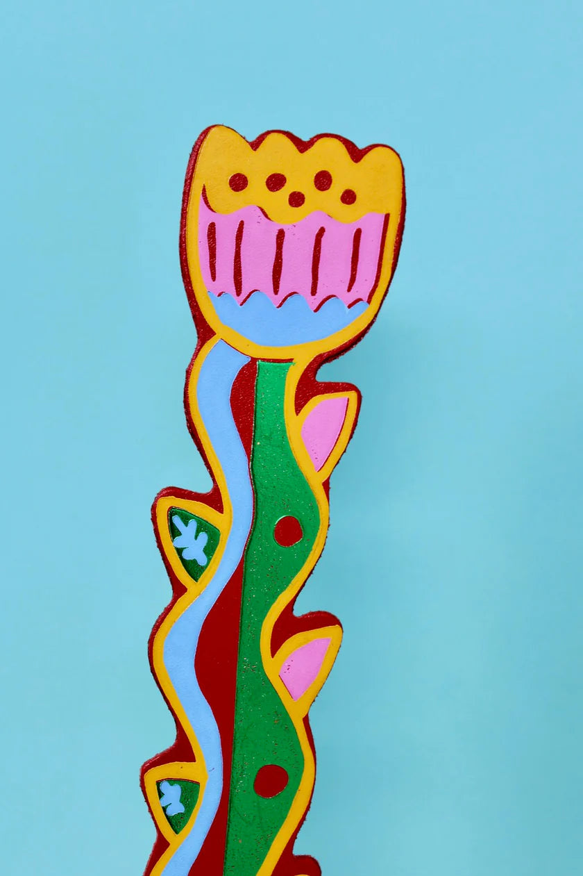 Colourful flower bookmark on a light blue background.