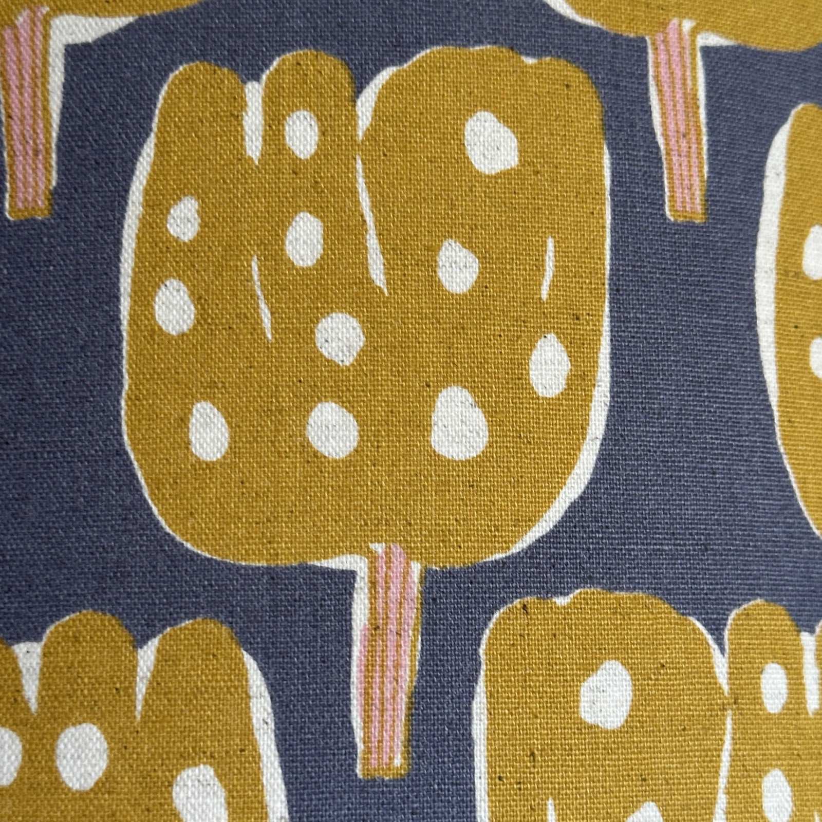 Grey canvas fabric with mustard tulip-shaped trees with pale pink tree trunks