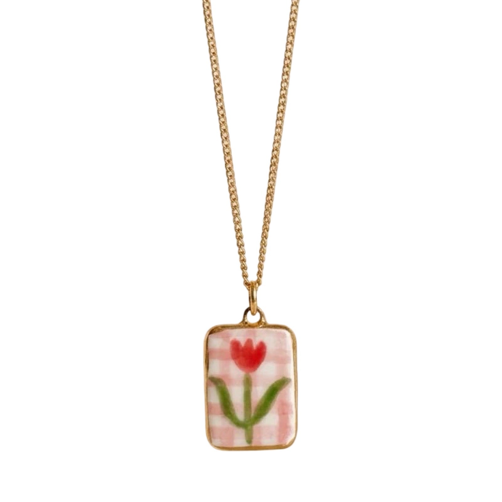 Necklace with a pendant featuring a red tulip design on a pink checkered background against a white background.