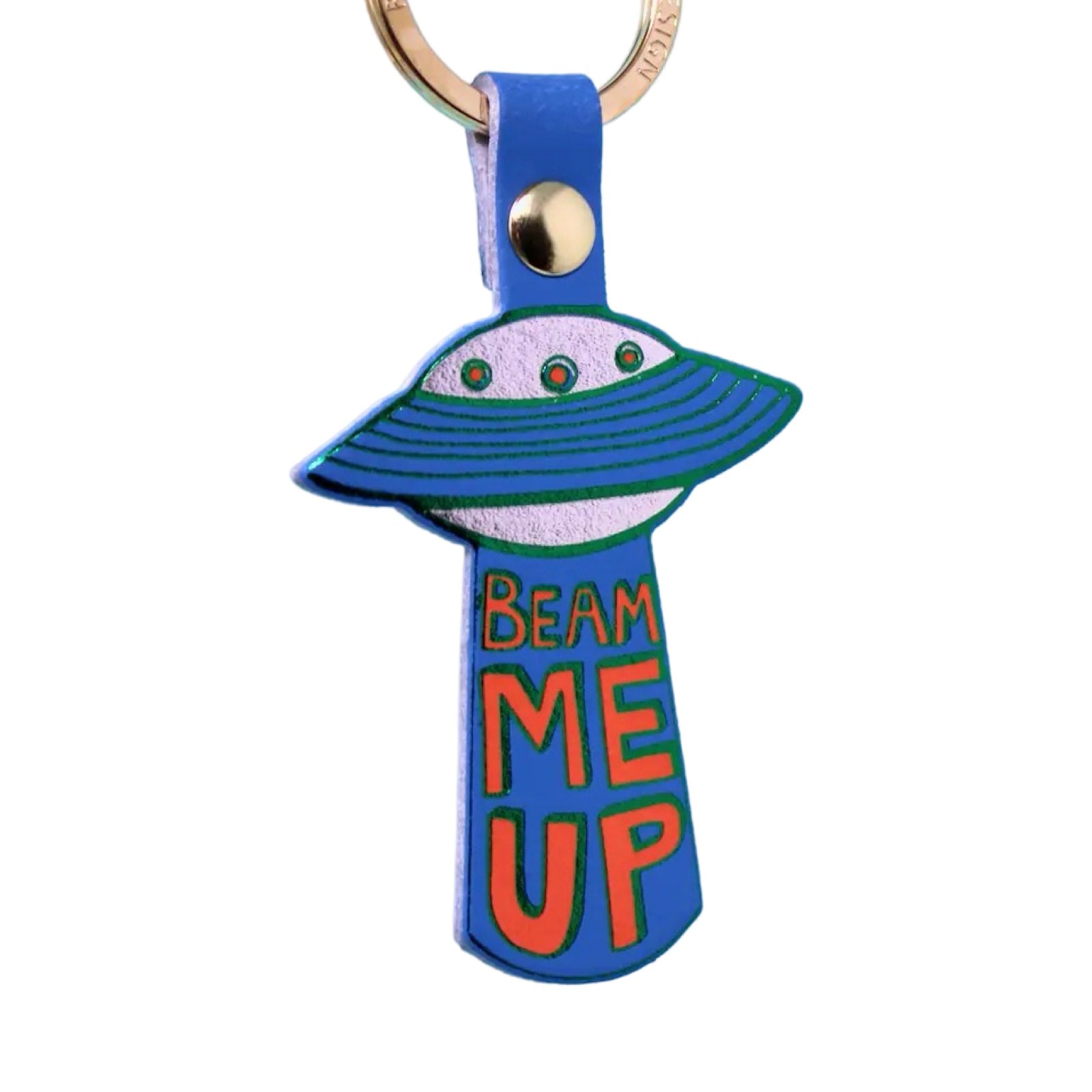 A blue leather UFO keyring of a silver spaceship with blue rings and the text 'Beam me up' written underneath in red lettering hanging from a gold-plated ring.