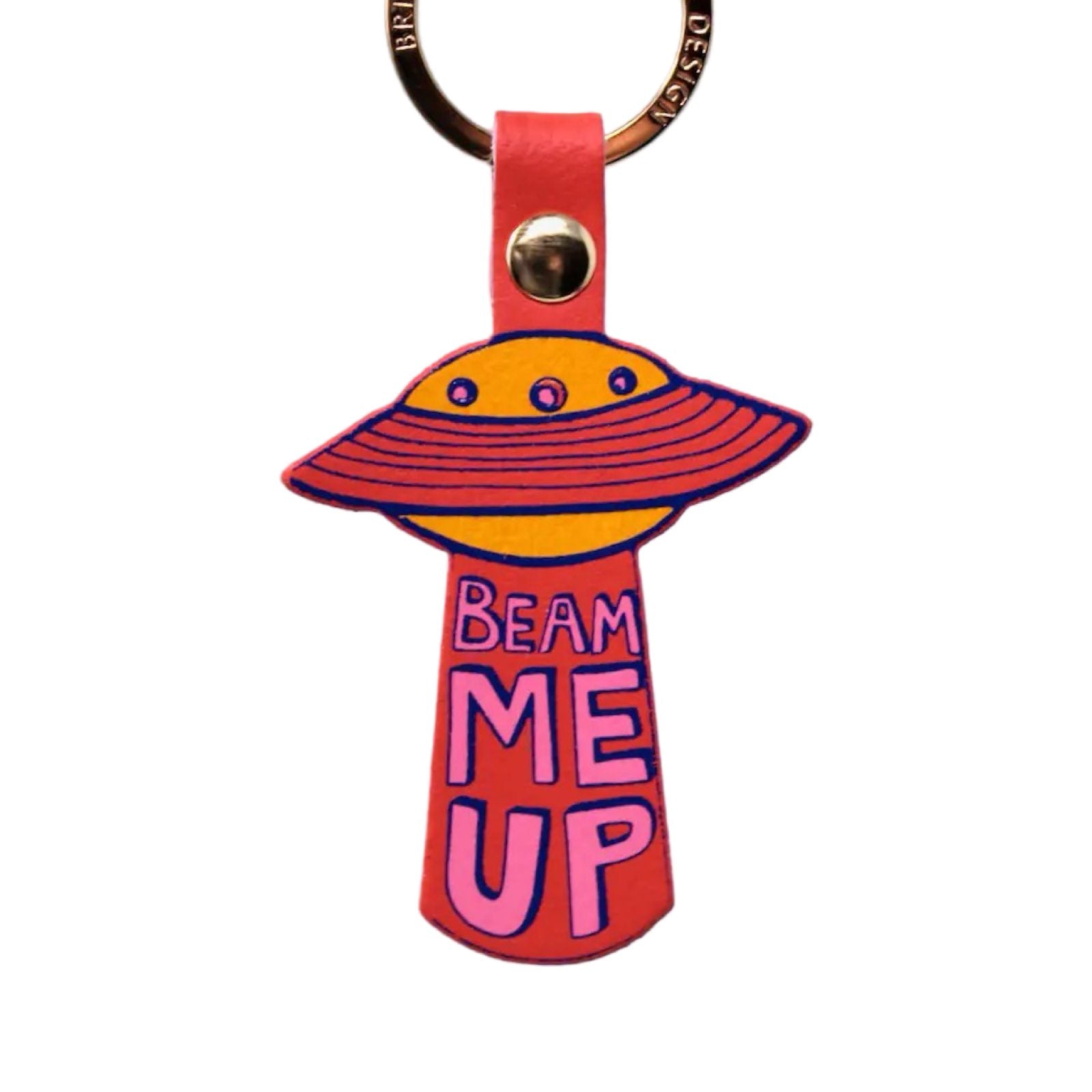 A red leather UFO keyring of an orange spaceship with red rings and the text 'Beam me up' written underneath in pink lettering hanging from a gold-plated ring.
