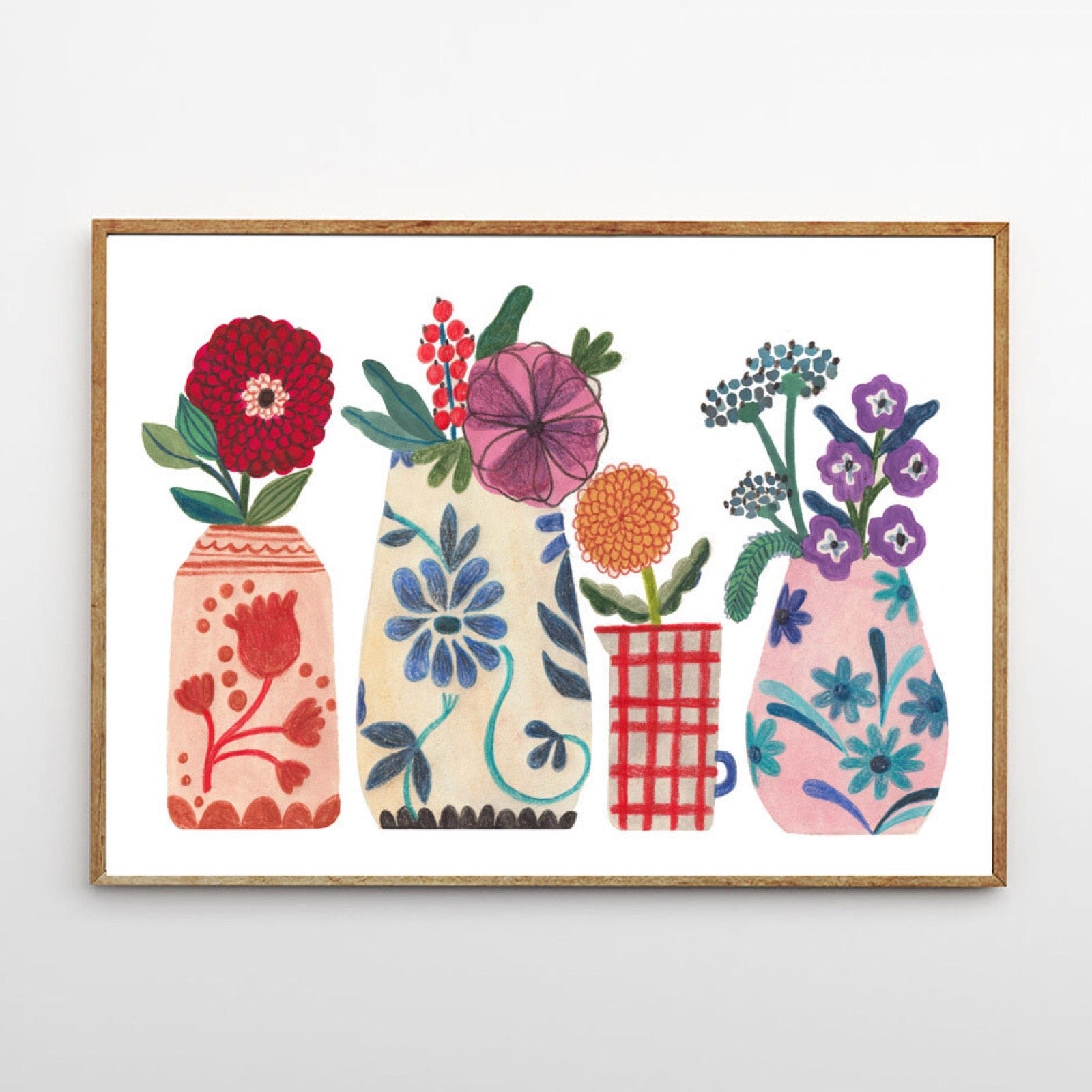 Framed artwork of colorful floral vases on a white background.