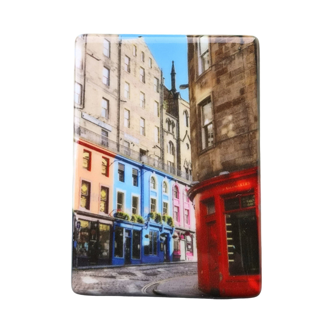 A rectangular ceramic magnet featuring a colourful picture of Victoria Street Edinburgh.