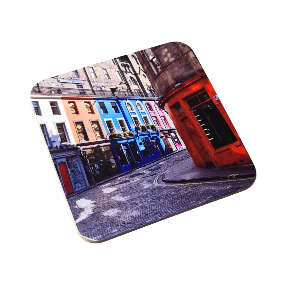 A coaster with a picture of Victoria Street Edinburgh on it against a white background.