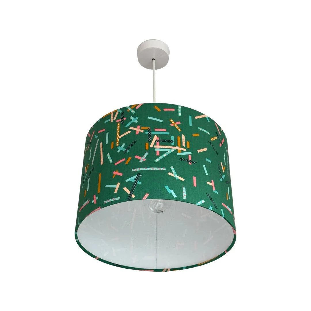drum lampshade covered in green cotton fabric with coloured strips
