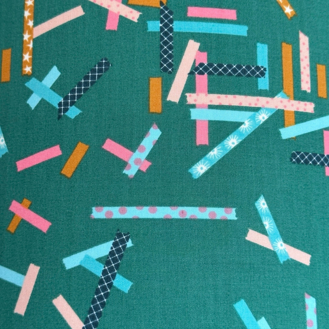 Green fabric with colourful washi tape inspired strips