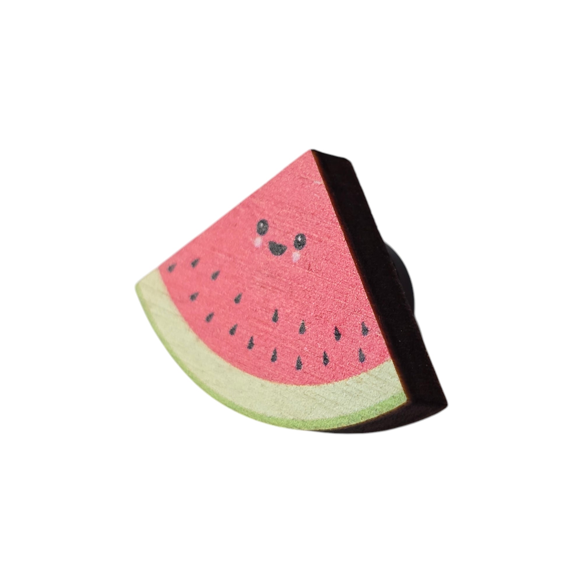 A water melon pin badge with a smiley face.