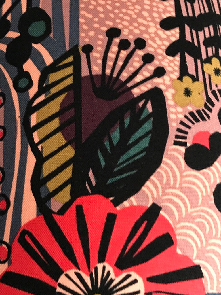 Fabric featuring a black, red and blue floral pattern