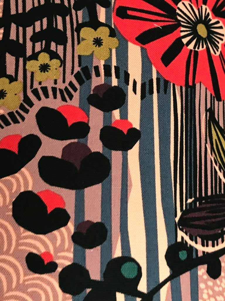Fabric featuring a black, red and blue floral pattern