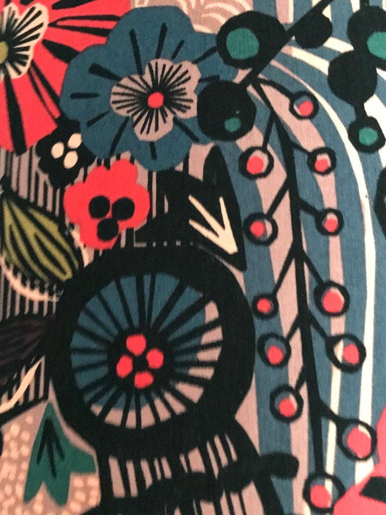 Fabric featuring a black, red and blue floral pattern