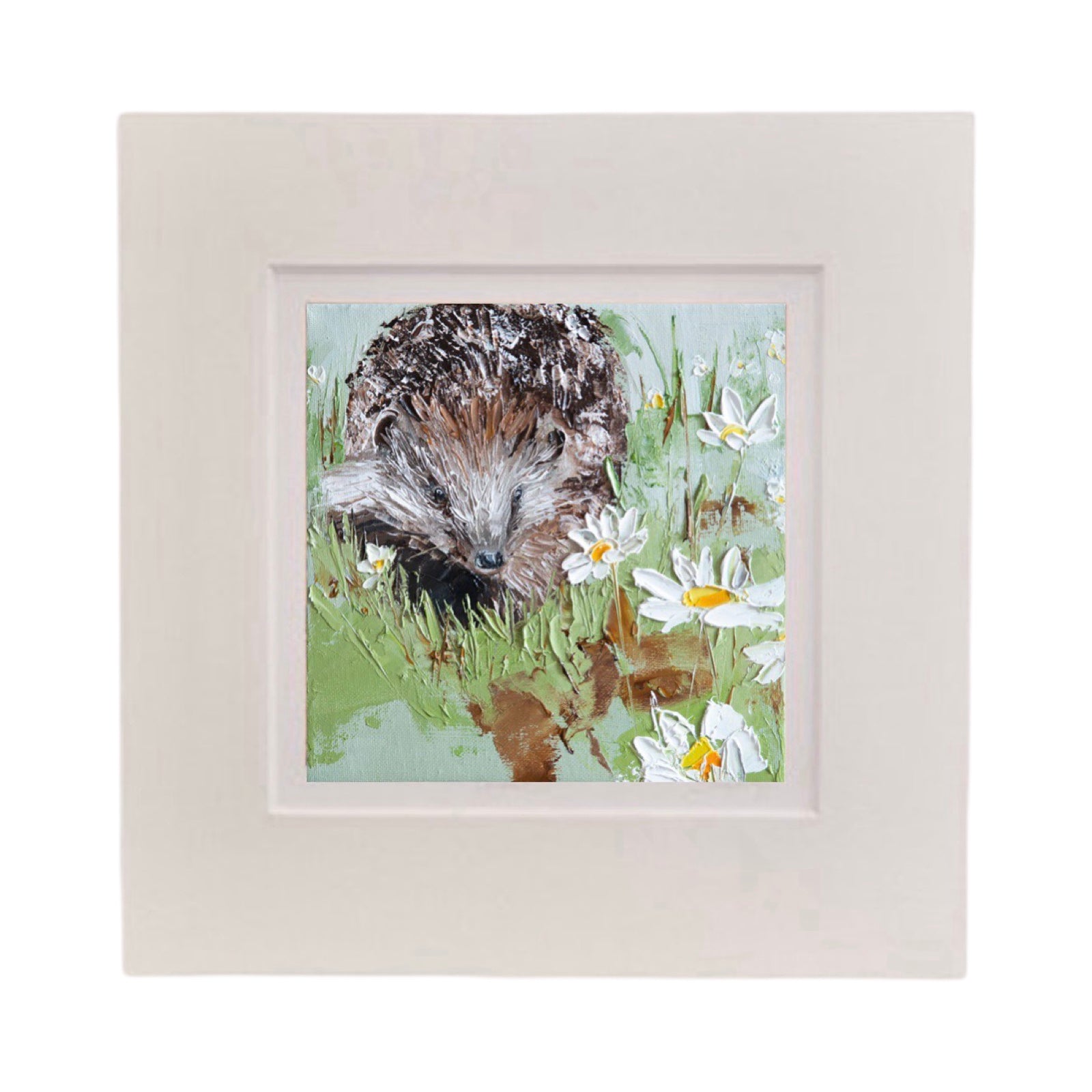 This square print features a hedgehog in a field of daisies in a white cardboard mount.