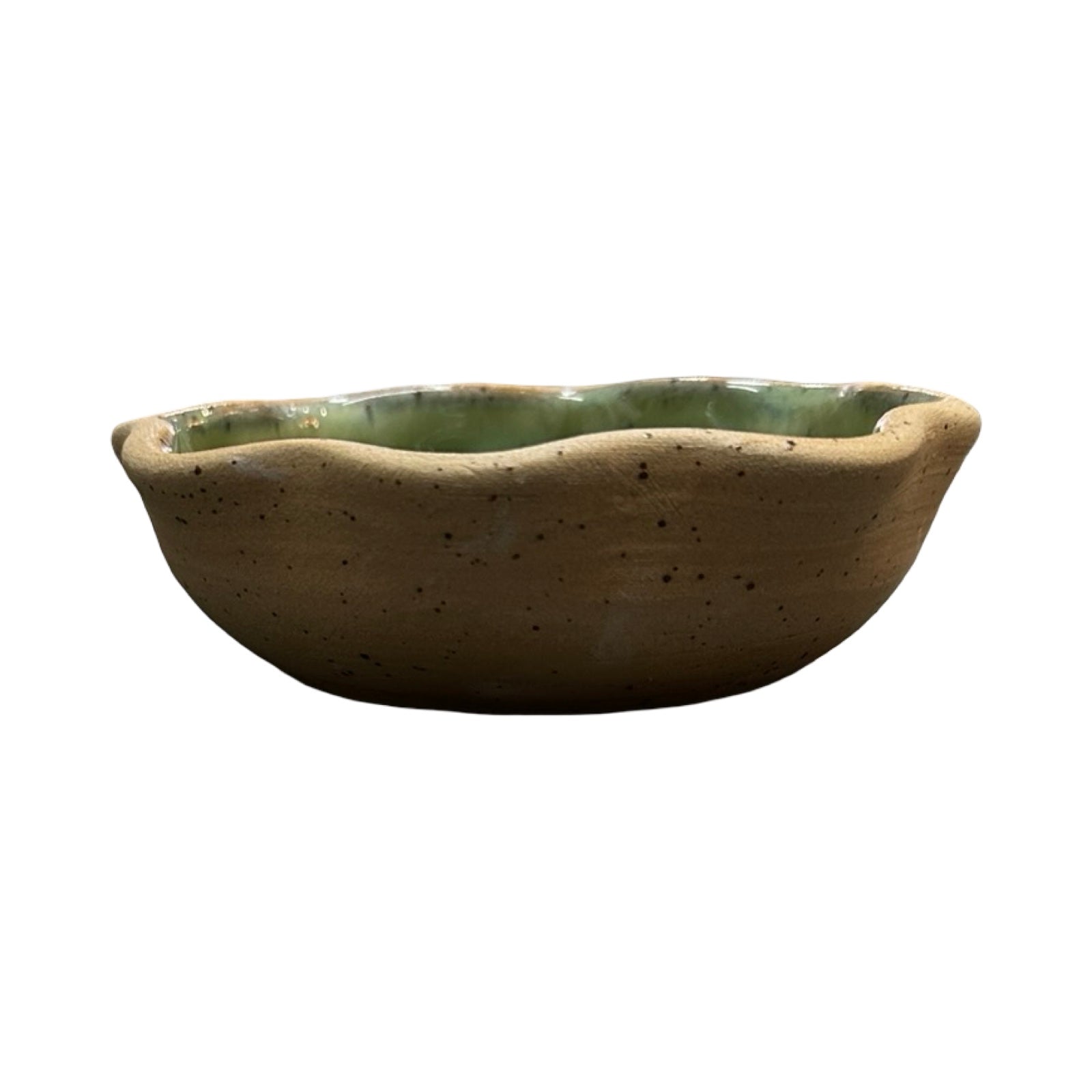 Ceramic dish with green interior and brown exterior on a white background.