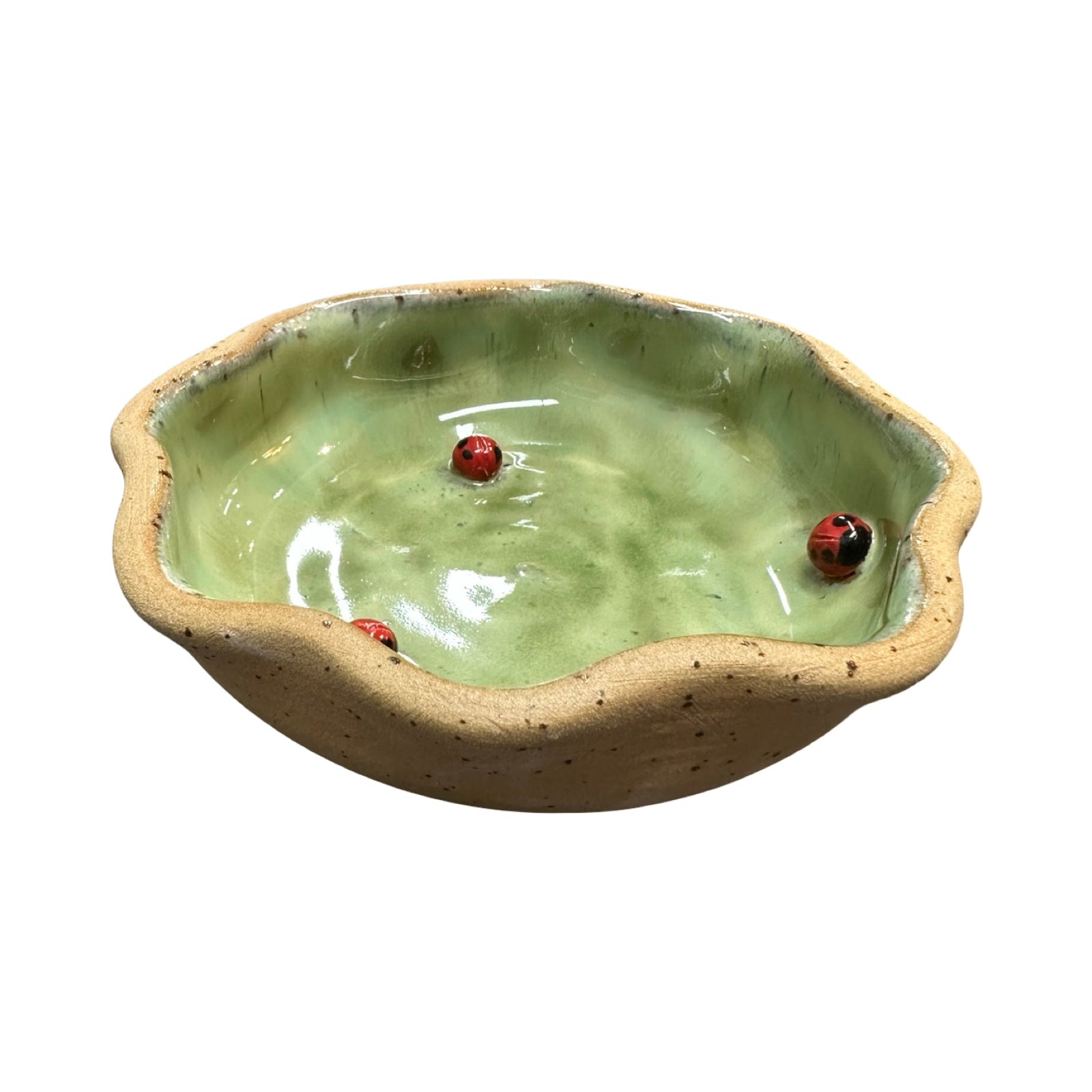 Ceramic dish with a green interior and beige exterior on a white background.