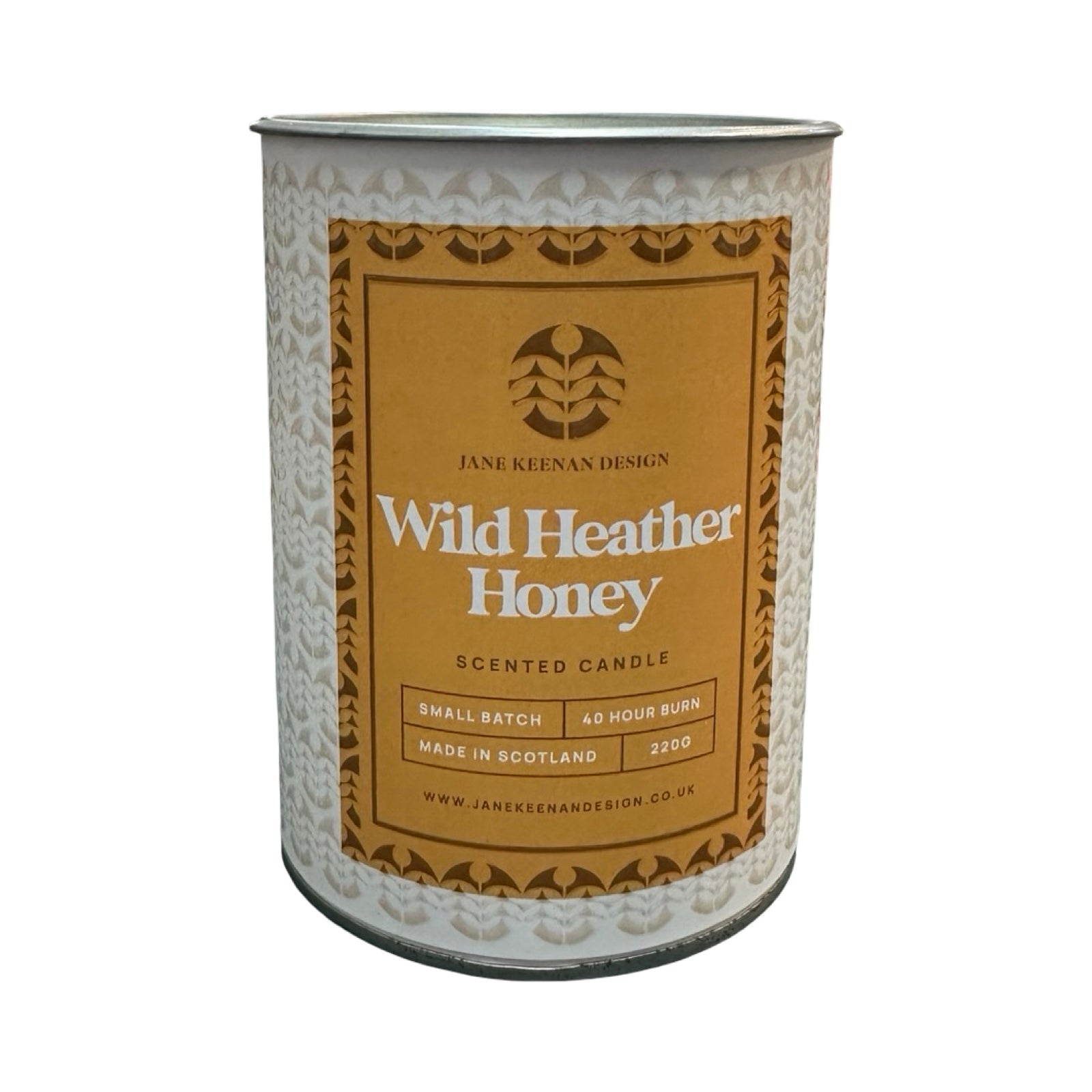 Cylindrical container with 'Wild Heather Honey' scented candle label on a white background.