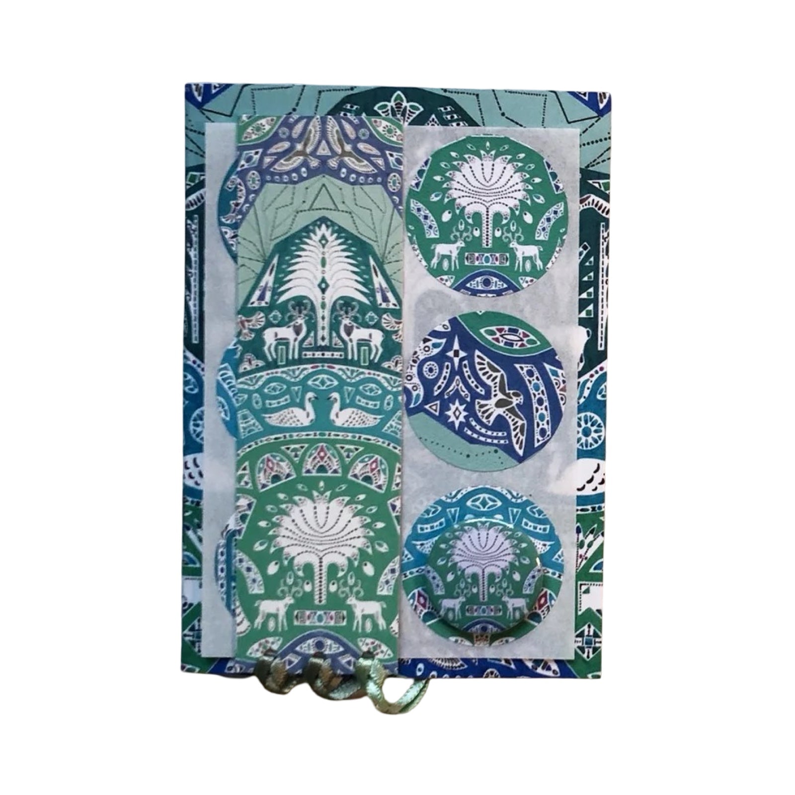 Decorative stationary set with green and blue patterns on a white background.
