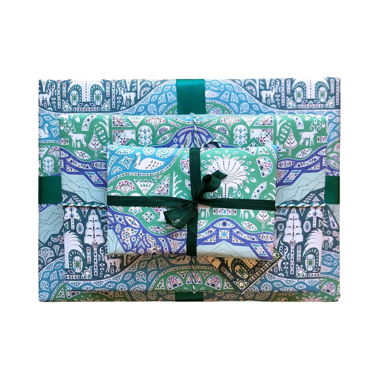 Packaged gift with decorative pattern and green ribbon on a white background.