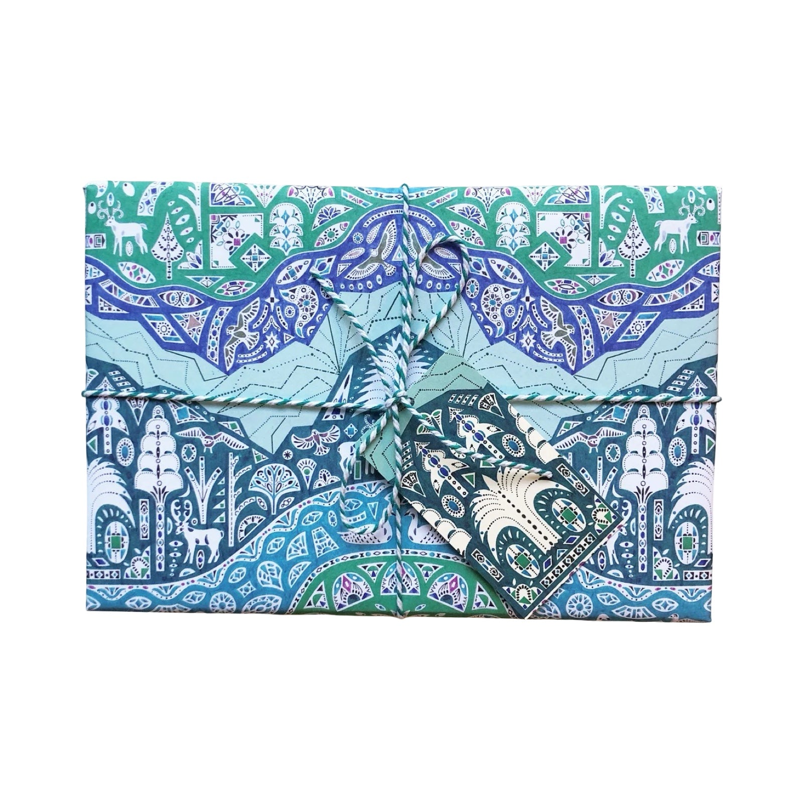 Patterned fabric with blue, green, and white design on a white background.