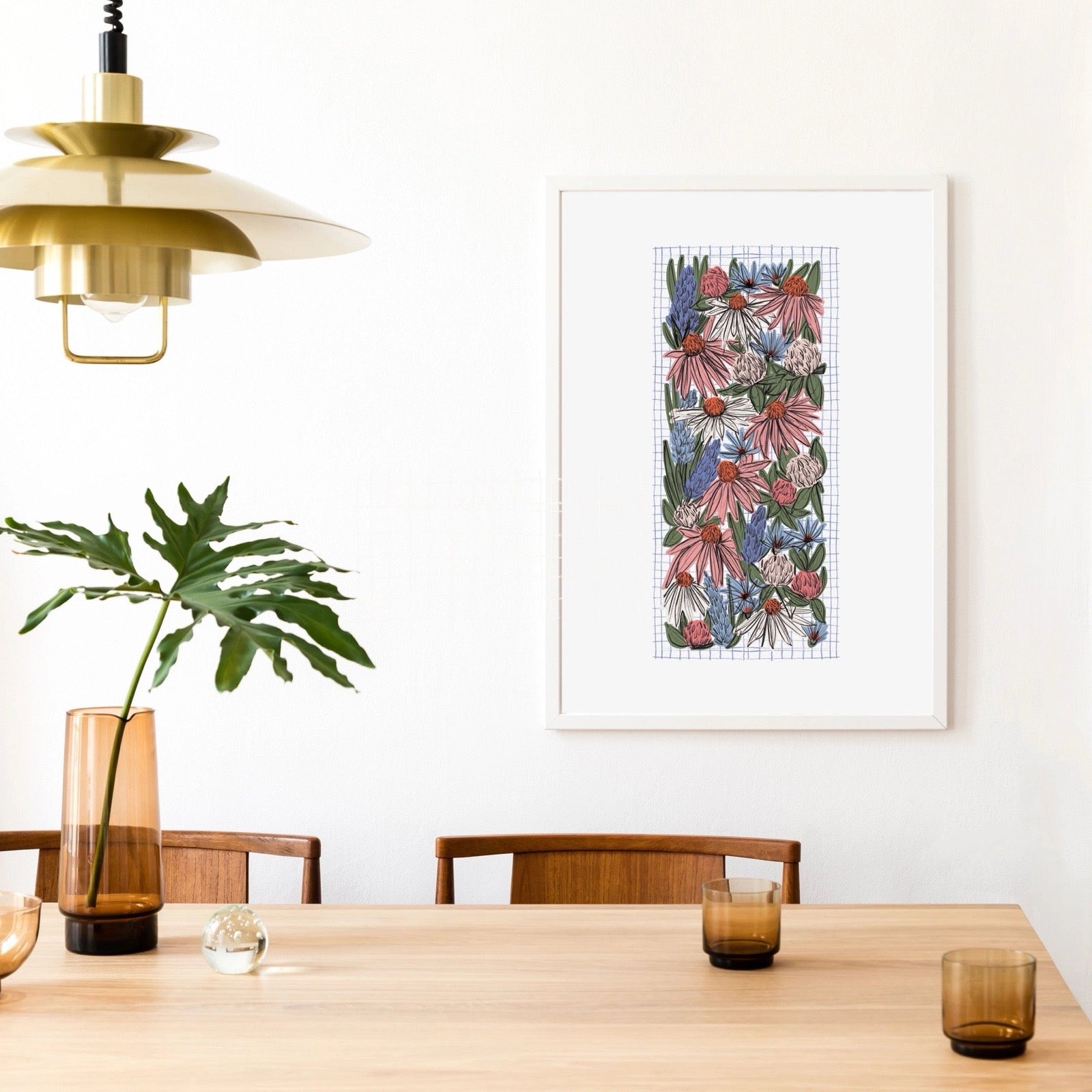 Dining room with a floral artwork on the wall, wooden table, and chairs.