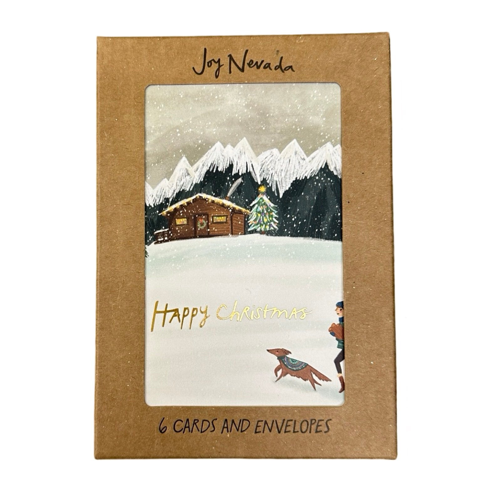 Christmas card pack featuring a wooden cabin amongst snowy mountains, with a person and their dog returning with firewood.