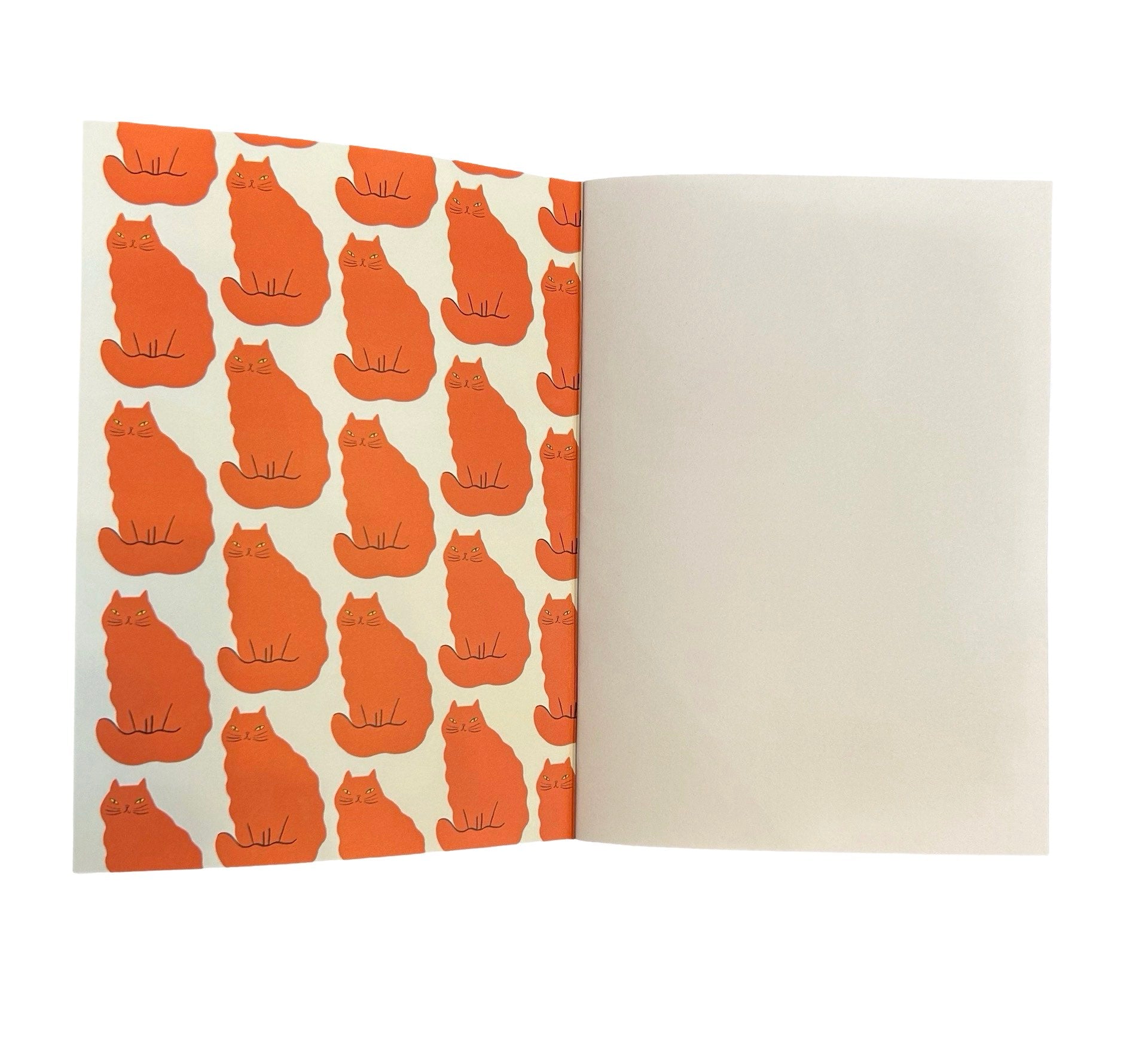 Inside of notebook with orange cat.