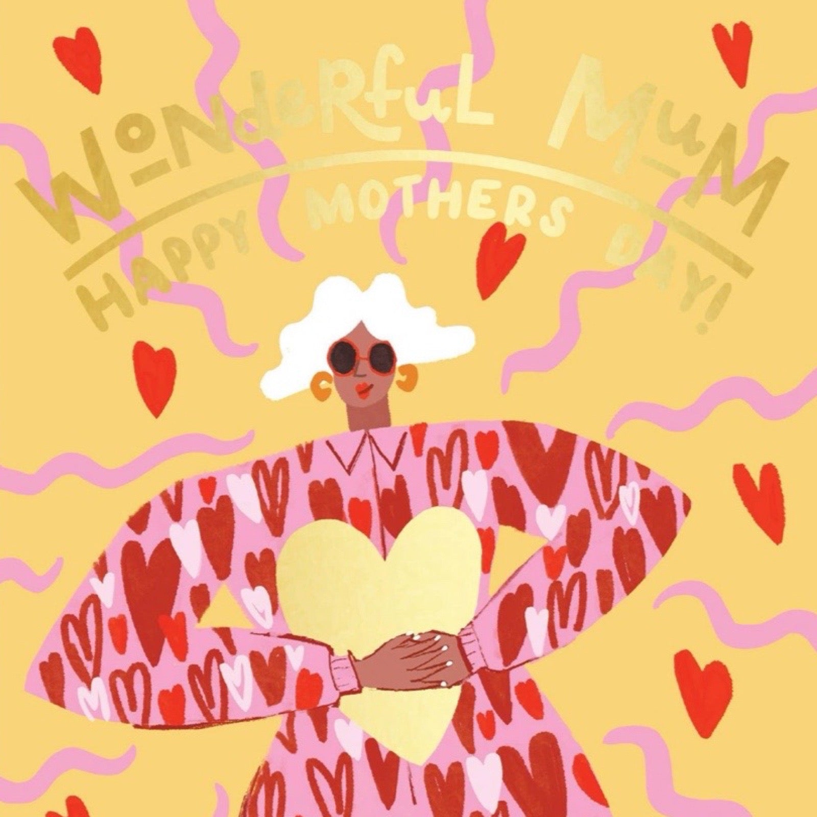 Mother's Day card featuring an illustration of a fabulous mum with white hair, wearing a red jumpsuit covered in love hearts, holding a giant gold love heart.