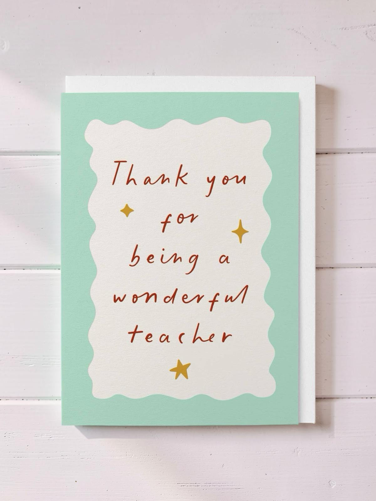 Card with 'Thank you for being a wonderful teacher' text on a light green background.