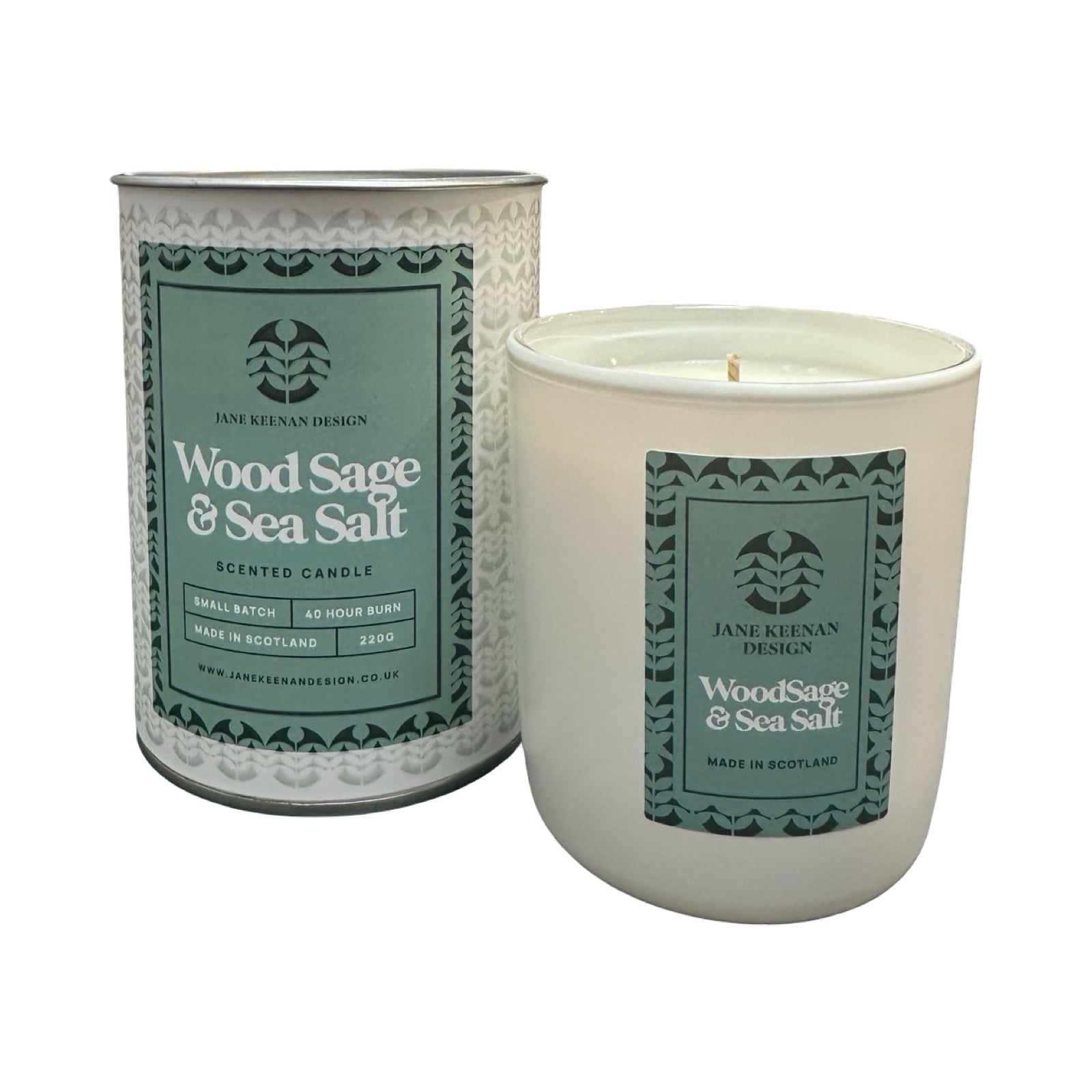 Candle and packaging with 'Wood Sage & Sea Salt' label on a white background.