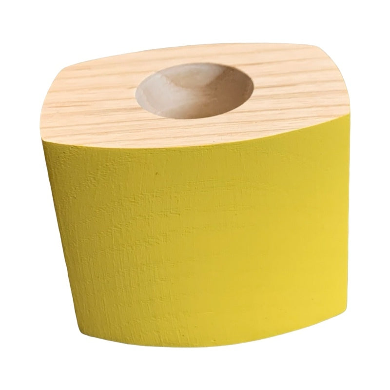 Yellow wooden candle holder.