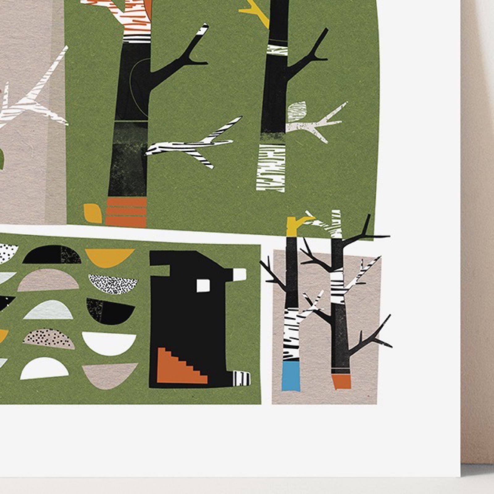 A square mixed media art print of a woodland village with houses, trees and grass, all in shades of green, black, white, grey and mustard.