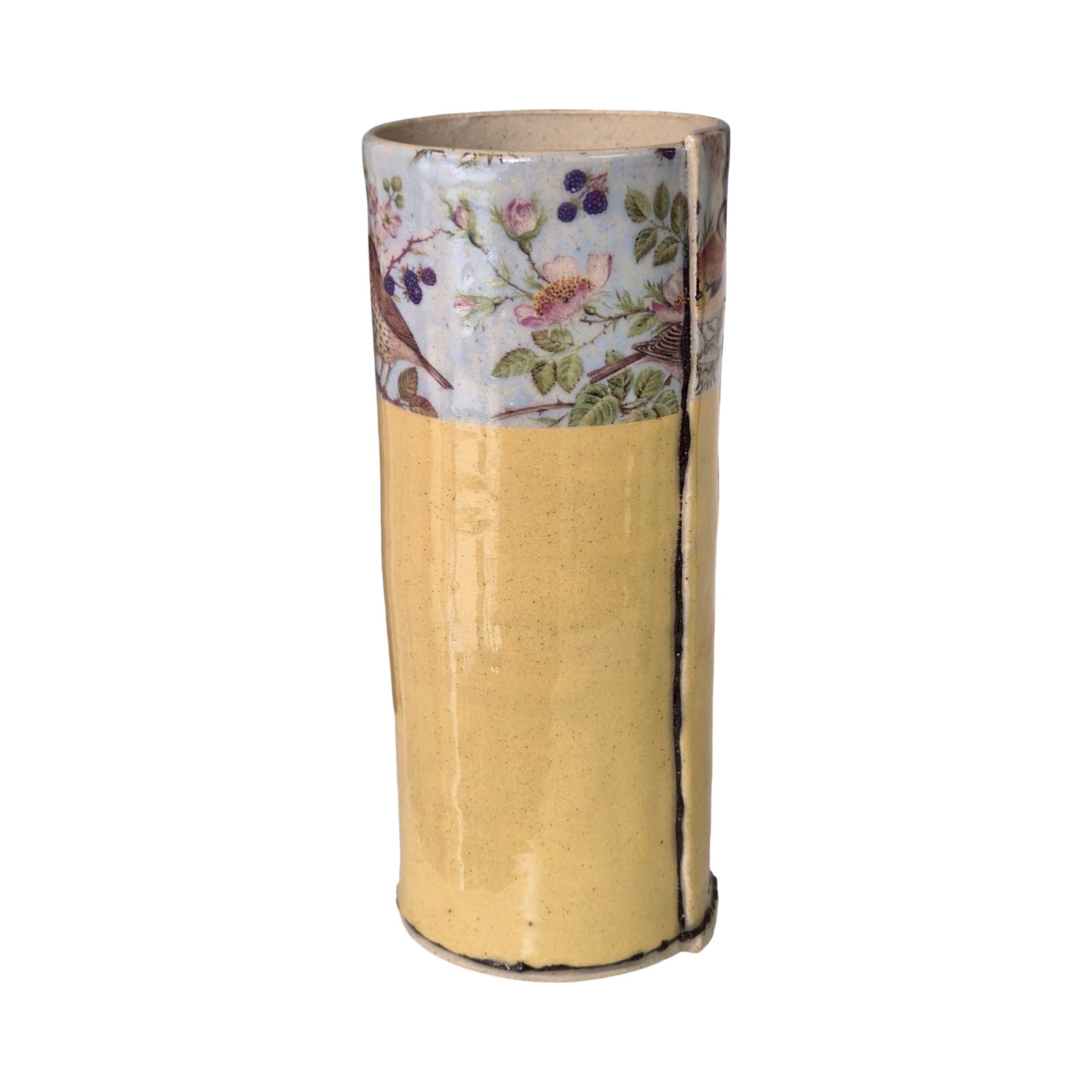 Cylindrical vase with floral patterned top section on a white background.