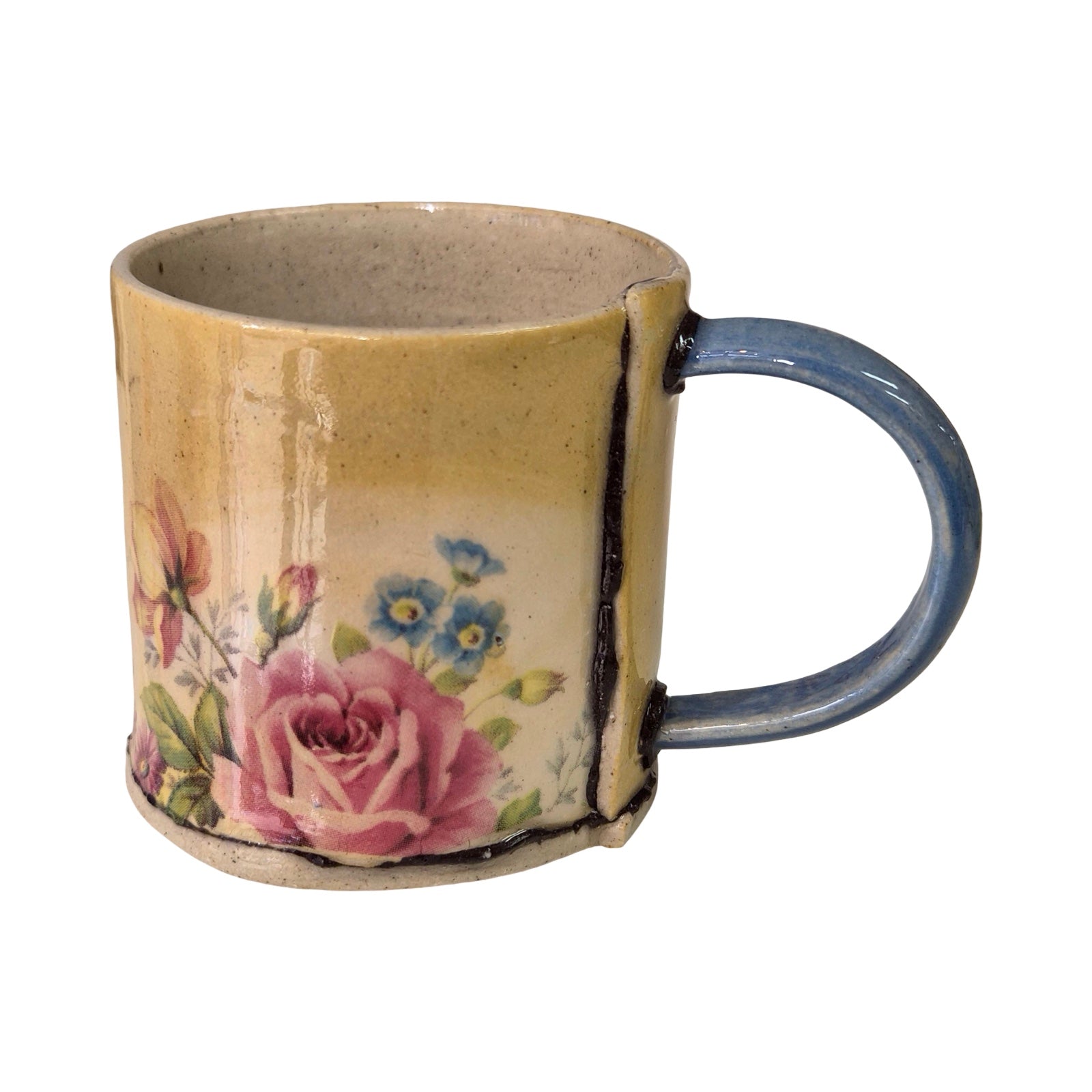 Ceramic mug with floral design on a white background.