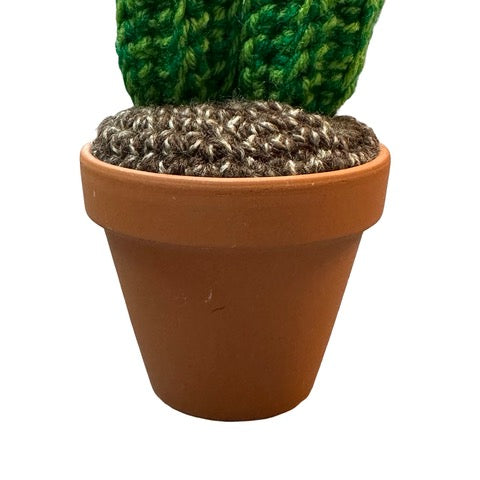 Handmade double stem crochet cactus with yellow flowers in a terracotta pot.