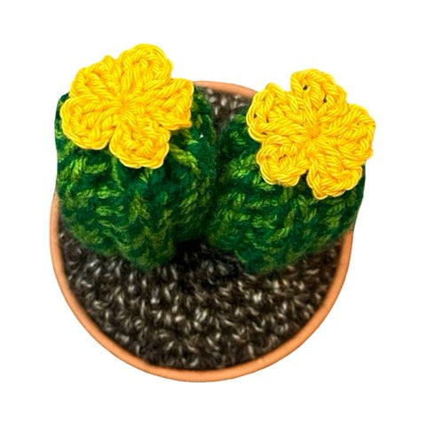 Handmade double stem crochet cactus with yellow flowers in a terracotta pot.